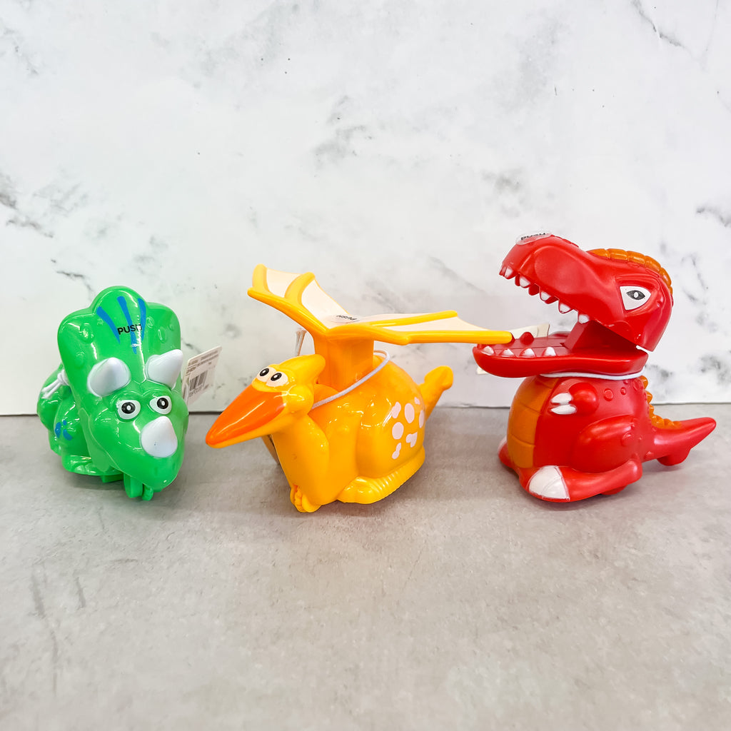 Push-and-Release Dinosaur - Lyla's: Clothing, Decor & More - Plano Boutique