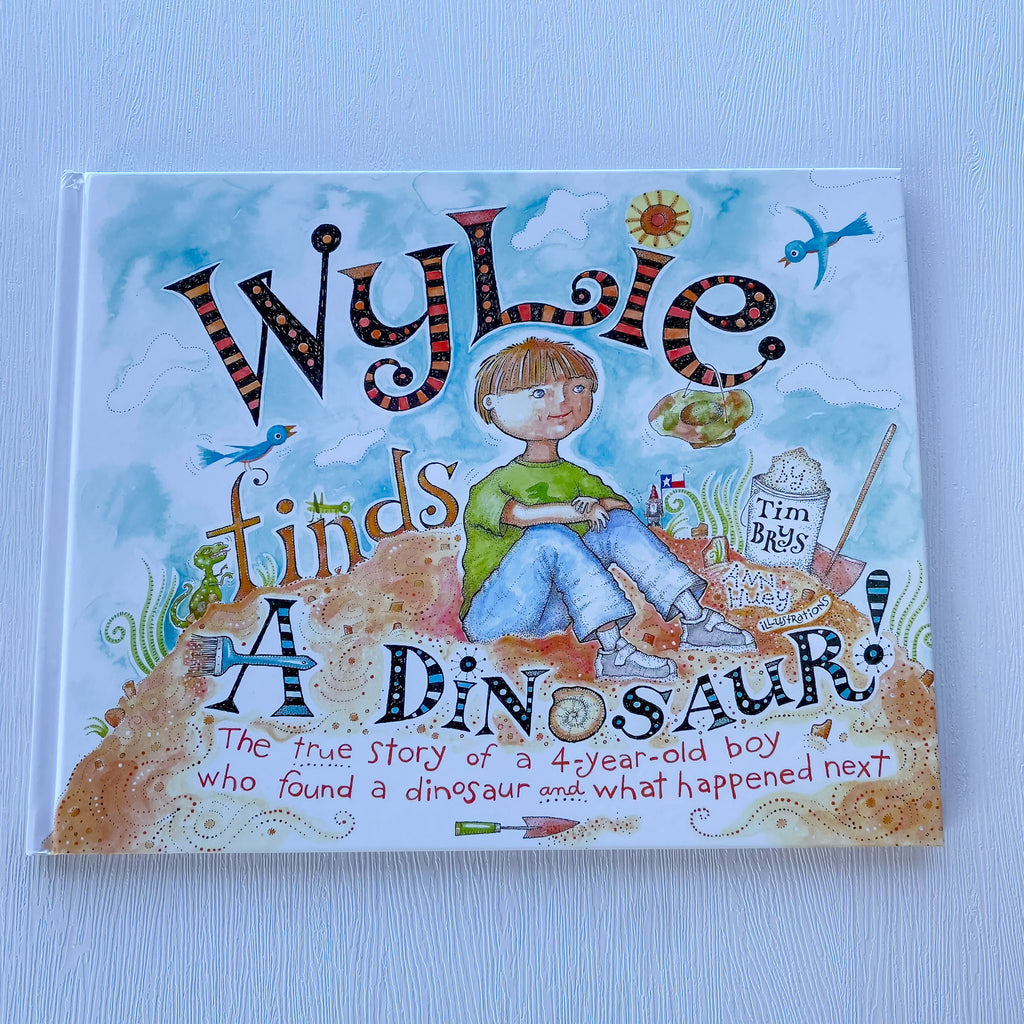 Wylie Finds a Dinosaur Book - Lyla's: Clothing, Decor & More - Plano Boutique