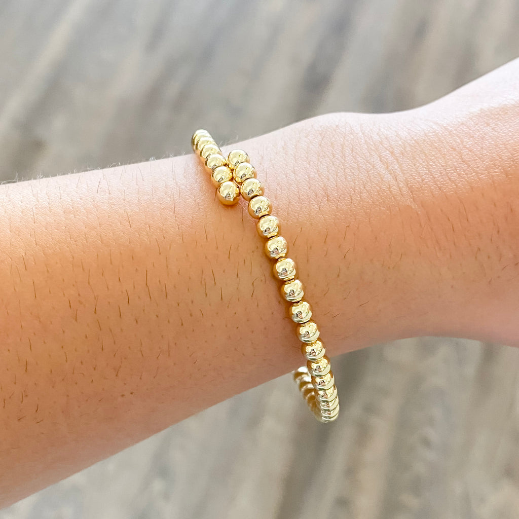 Bracelet in Gold Beaded Flexi Bracelet in Gold - Lyla's: Clothing, Decor & More - Plano Boutique