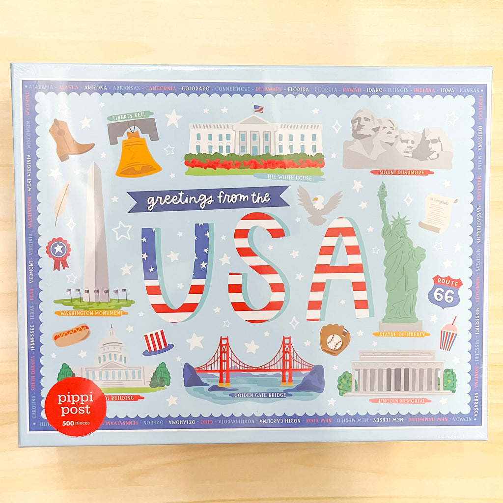 Greetings from the USA - 500 Piece Jigsaw Puzzle - Lyla's: Clothing, Decor & More - Plano Boutique