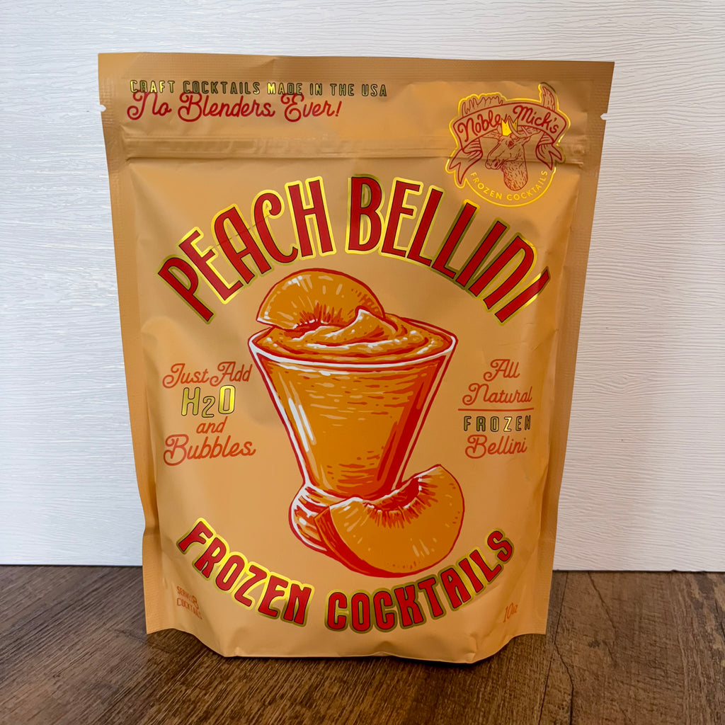 Frozen Peach Bellini Cocktail by Noble Micks - Lyla's: Clothing, Decor & More - Plano Boutique