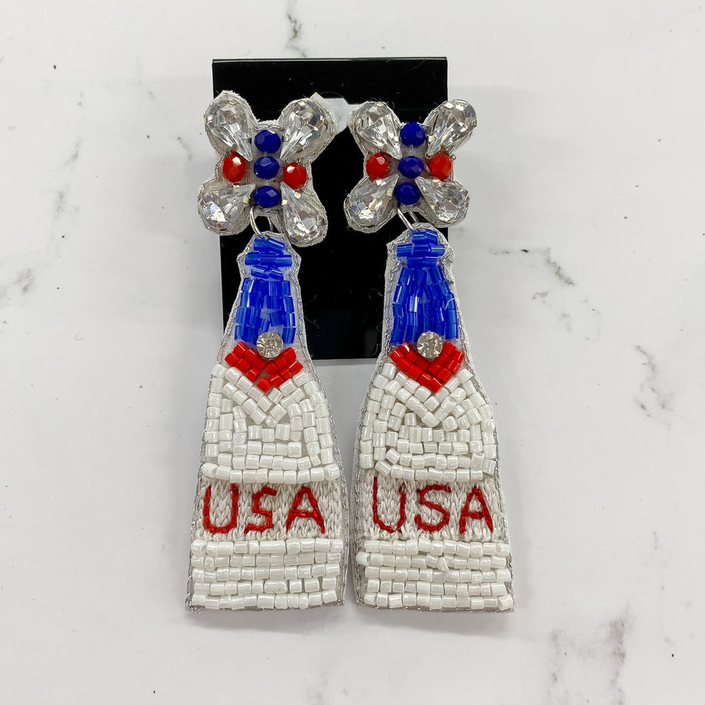 USA Champagne Bottle Earrings - Lyla's: Clothing, Decor & More - Plano Boutique